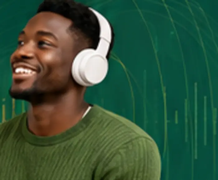 Creator listening to localized audio through headphones